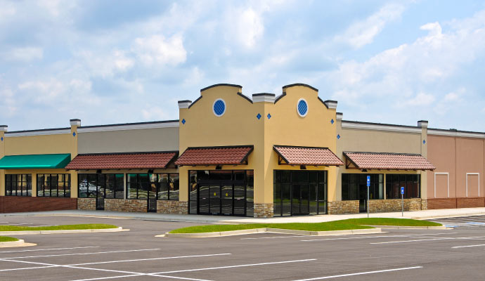 Retail store exterior with parking lot