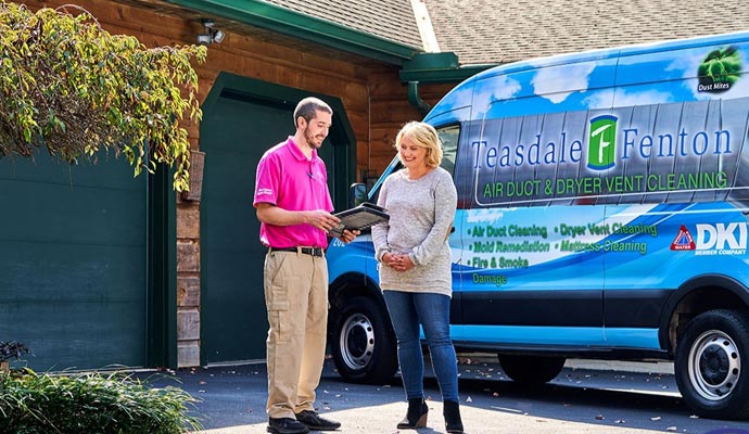 Teasdale Pressure Washing expert discuss with client