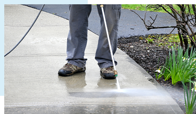 Pressure washing service in action.