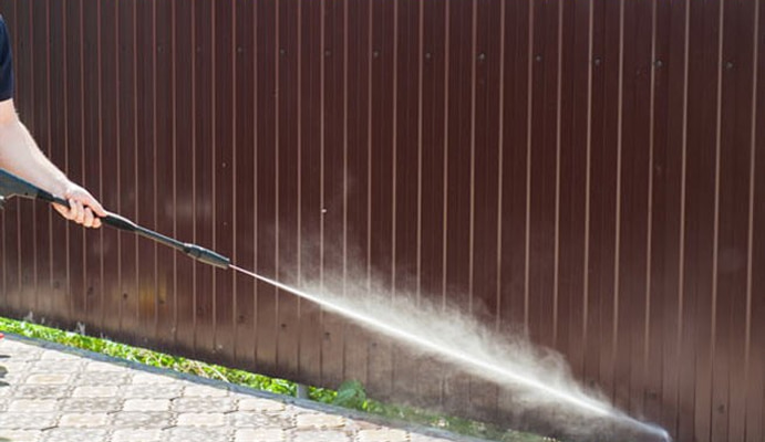 Fence cleaning by power pressure washing
