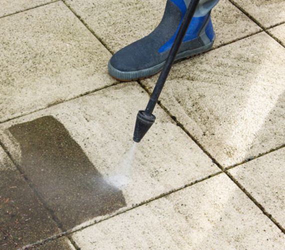 Pressure washing stain removal