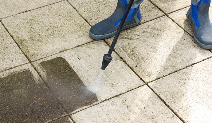 Pressure washing for stain removal