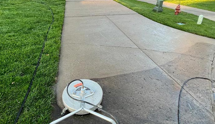 removing stains from concrete surface by pressure washing