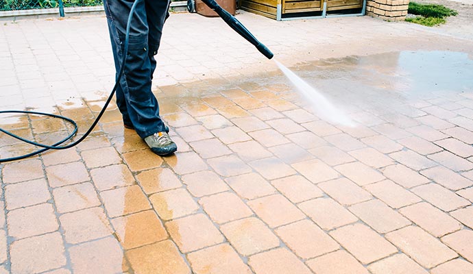 Outdoor floor cleaning with pressure washing