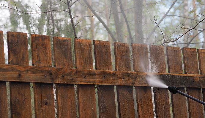 Wooden fence pressure washing