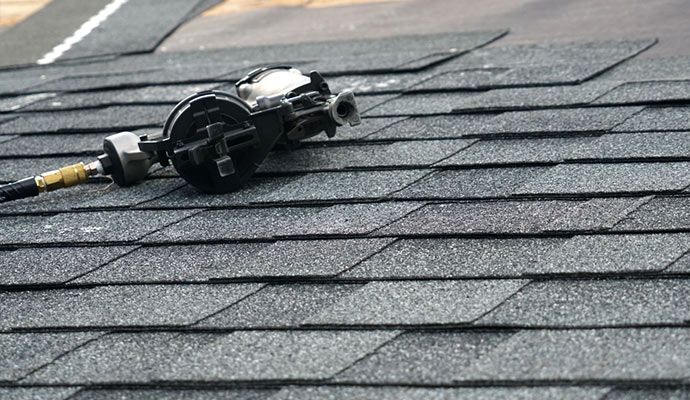 Professional shingle restoration using equipment