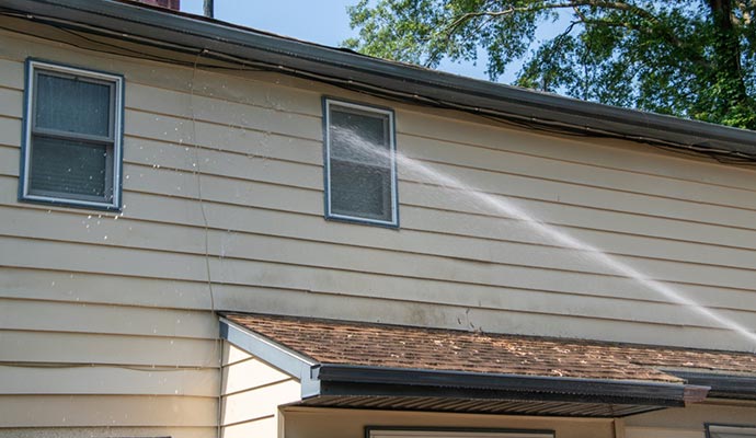 Soft washing the siding of a house